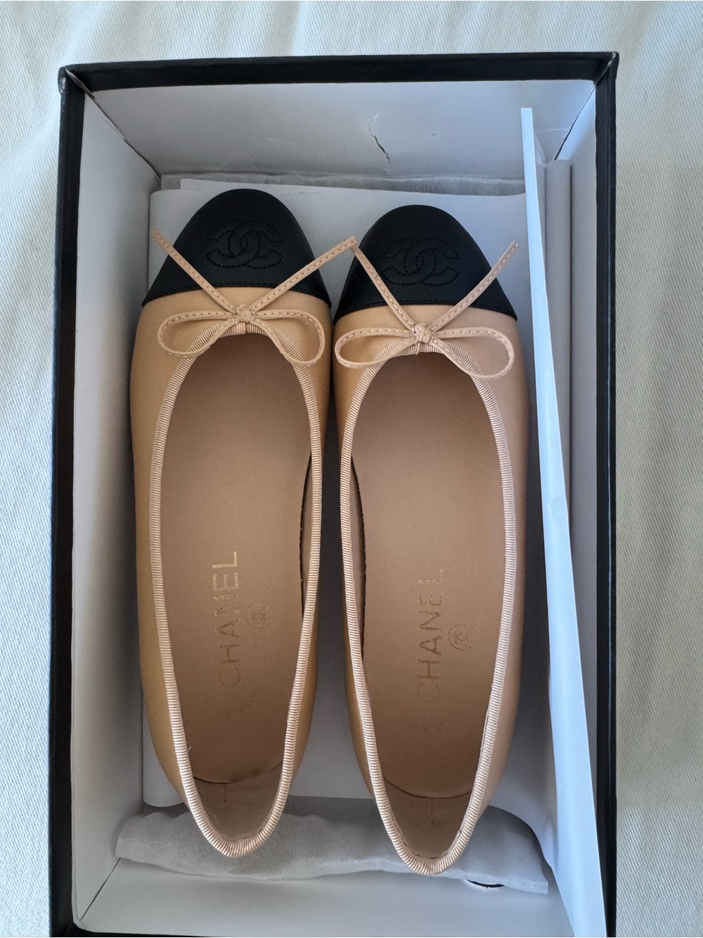 CHANEL Two-Tone Leather Ballerina Flats in Beige and Black